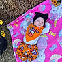 baby, blanket, child, costume, cute, fall, flowers, halloween, hat, hay, headwear, holiday, infant, nature, outdoor, patterned_clothing, pink, resting, sleeping, striped_socks