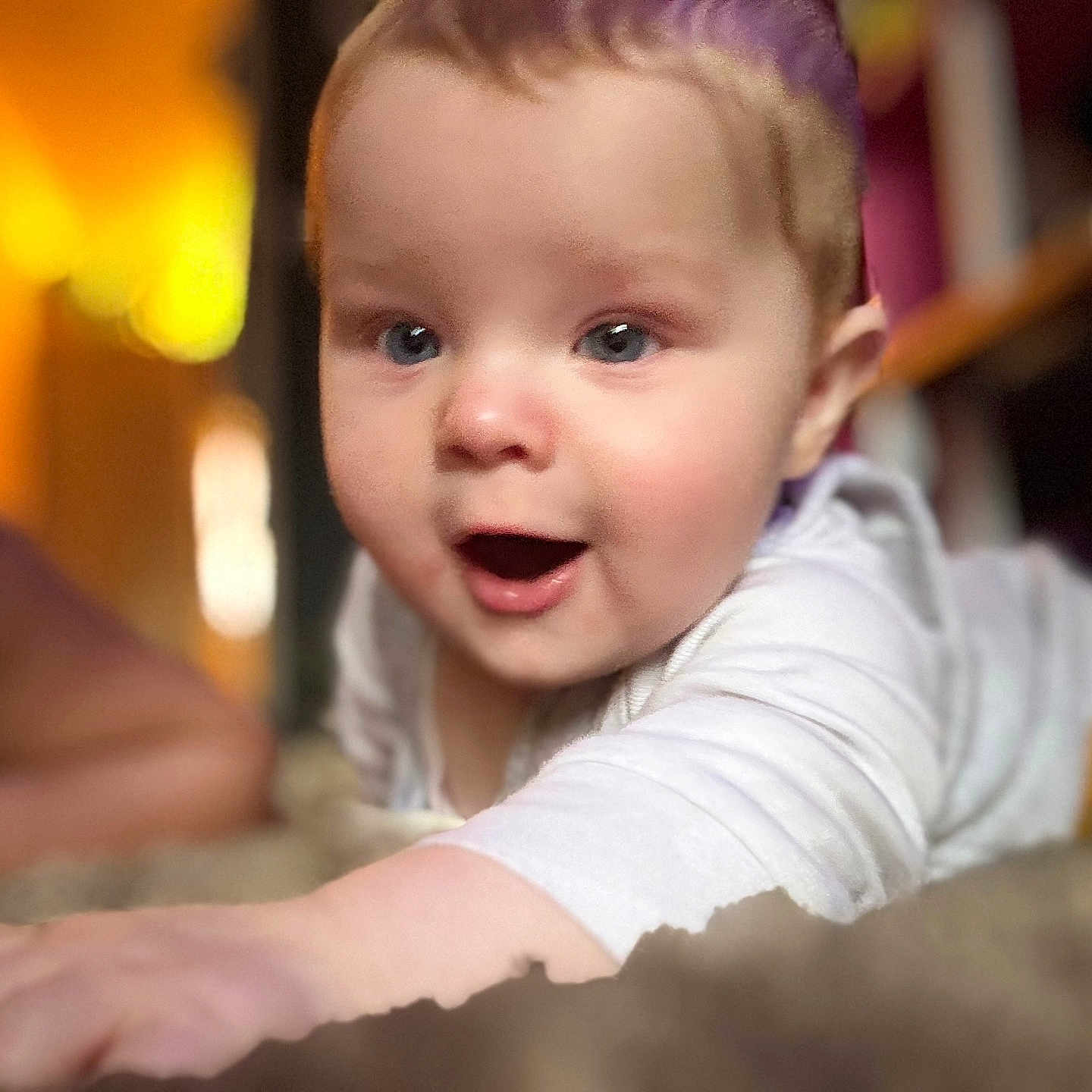Albie-James joined the competition — help win amazing prizes! baby, blue_eyes, blurred_background, child, closeup, crawling, curious, cute, expression, face, hand, indoor, infant, person, portrait, skin, soft_light, warm_colors, white_clothing, young