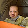 Albie-James is registered to the contest to win money with this photo: baby, child, smiling, blanket, stroller, orange, happy, infant, face, portrait, cute, outdoor, clothing, seatbelt, expression, head, person, cozy, closeup, comfort