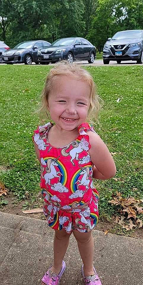 Joplyn joined the competition — help win amazing prizes! automotive_tire, baby_toddler_clothing, car, cool, eye, face, grass, happy, iris, joy, light, mammal, people_in_nature, person, pink, plant, shoulder, smile, tire, vehicle