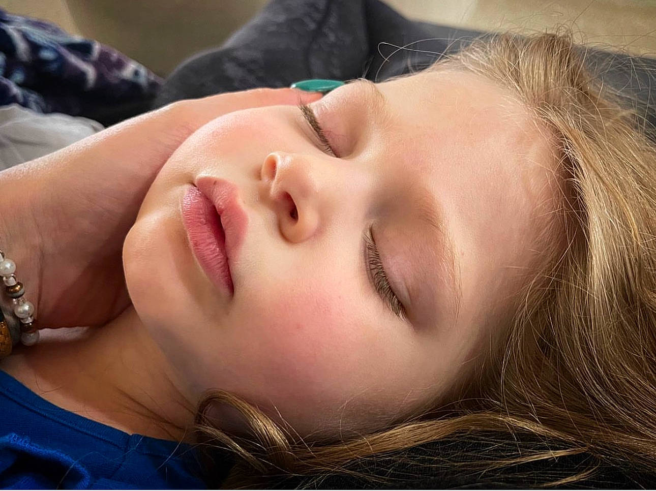 Adriana is registered to the contest to win money with this photo: black_hair, blond, cheek, child, close_up, comfort, ear, eyebrow, eyelash, eyewear, flash_photography, forehead, grass, happy, lip, mouth, neck, nose, person, skin