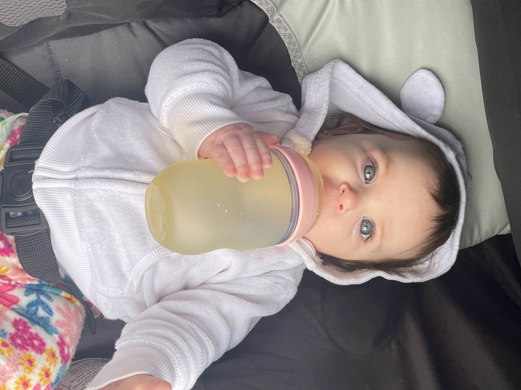 Isabella is registered to the contest to win money with this photo: baby, baby_bottle, baby_products, baby_toddler_clothing, bottle, cheek, child, comfort, drinking, drinkware, eyelash, head, milk, mouth, person, plant_milk, plastic_bottle, product, skin, sleeve