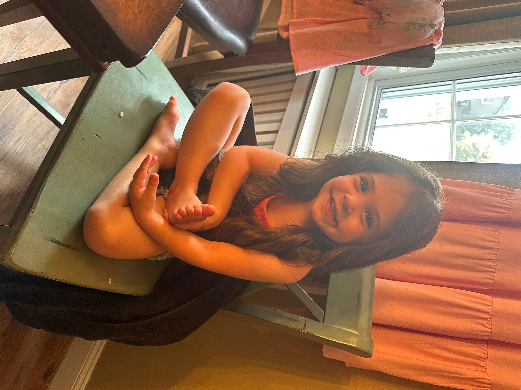 Lily is registered to the contest to win money with this photo: automotive_design, automotive_exterior, comfort, dress, elbow, eyewear, fun, human_leg, joint, joy, leisure, motor_vehicle, orange, person, plant, public_transport, sunglasses, thigh, vehicle, vehicle_door