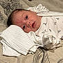 Noah joined the competition — help win amazing prizes! baby, infant, child, onesie, blanket, pattern, zebra_print, white_cloth, lying_down, face, blue_eyes, soft_texture, indoors, cute, resting, newborn, sleepwear, portrait, young_child, head_support