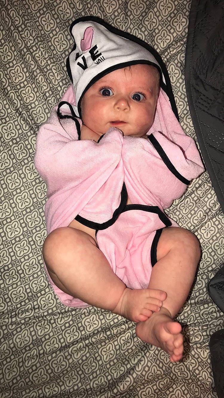 Sadie Mae  is registered to the contest to win money with this photo: baby, baby_products, baby_toddler_clothing, cheek, child, eye, head, headgear, headwear, leg, person, pink, product, sitting, skin, toddler