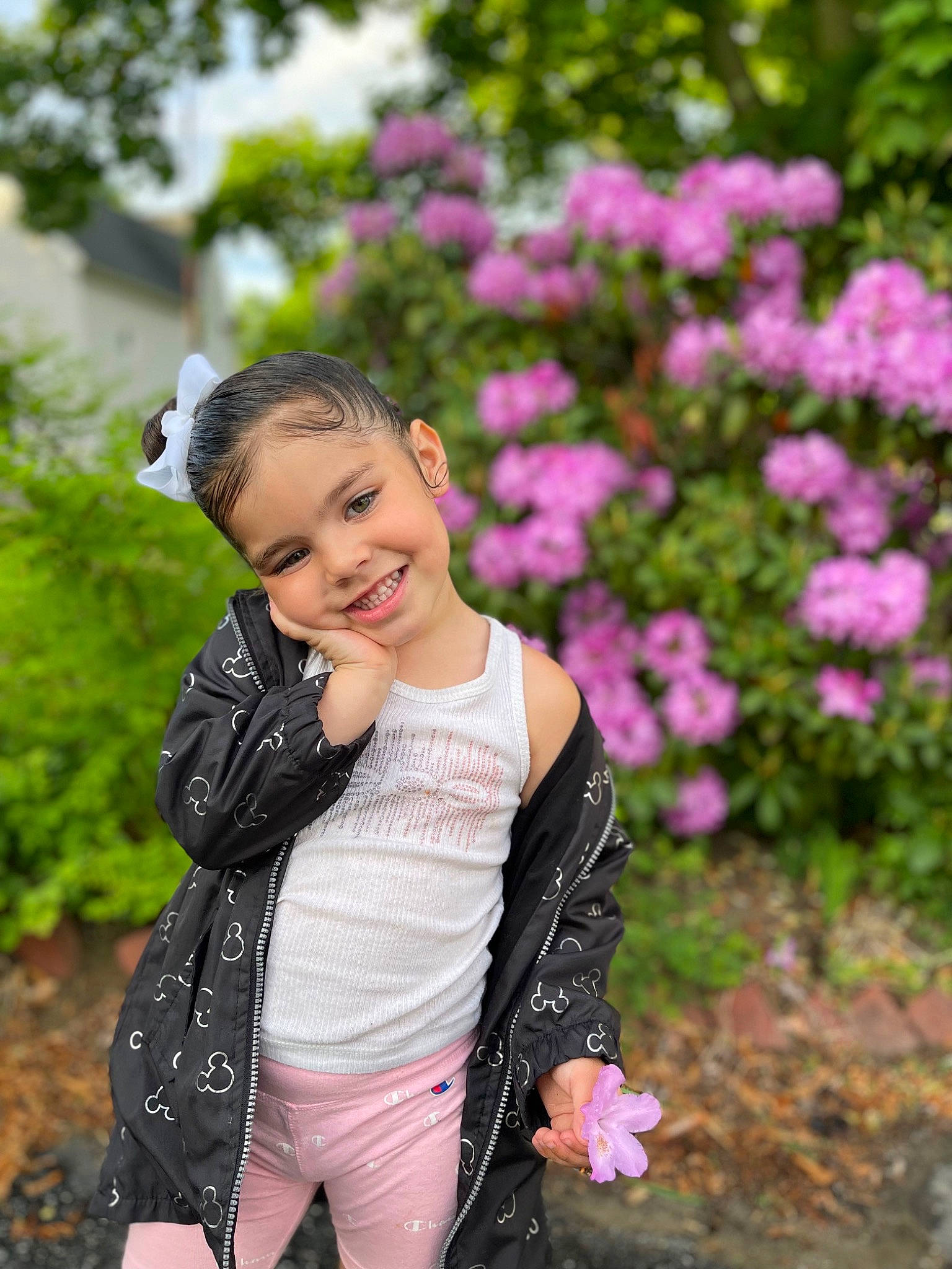 Leylani is registered to the contest to win money with this photo: beauty, botany, face, flash_photography, flower, grass, happy, human_body, joy, leisure, magenta, outerwear, people_in_nature, person, petal, pink, plant, sleeve, smile, summer