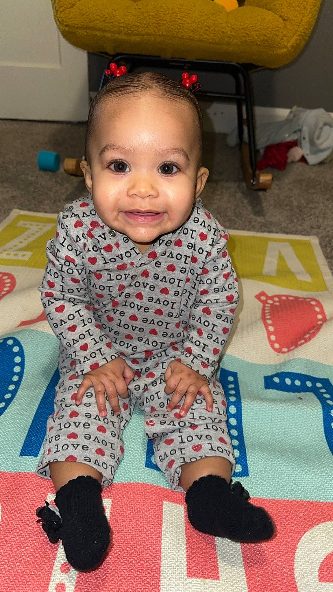 Layana is registered to the contest to win money with this photo: arm, baby, baby_toddler_clothing, cheek, child, electric_blue, face, flooring, fun, happy, head, human_leg, iris, joy, pattern, person, red, room, skin, sleeve