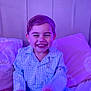 Jaxson joined the competition — help win amazing prizes! child, toddler, pajamas, smiling, bed, pillow, indoor, happy, sleepwear, young_child, face, cute, portrait, seated, fun, purple_light, cozy, bedroom, joyful, laughing