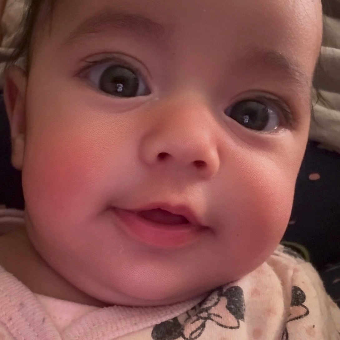 Jouri joined the competition — help win amazing prizes! adorable, baby, cartoon_print, child, chubby_cheeks, close_up, cute, expression, eyelashes, face, head, indoor, infant, minnie_mouse, pink_clothing, portrait, sleepwear, smile, soft_lighting, young_child