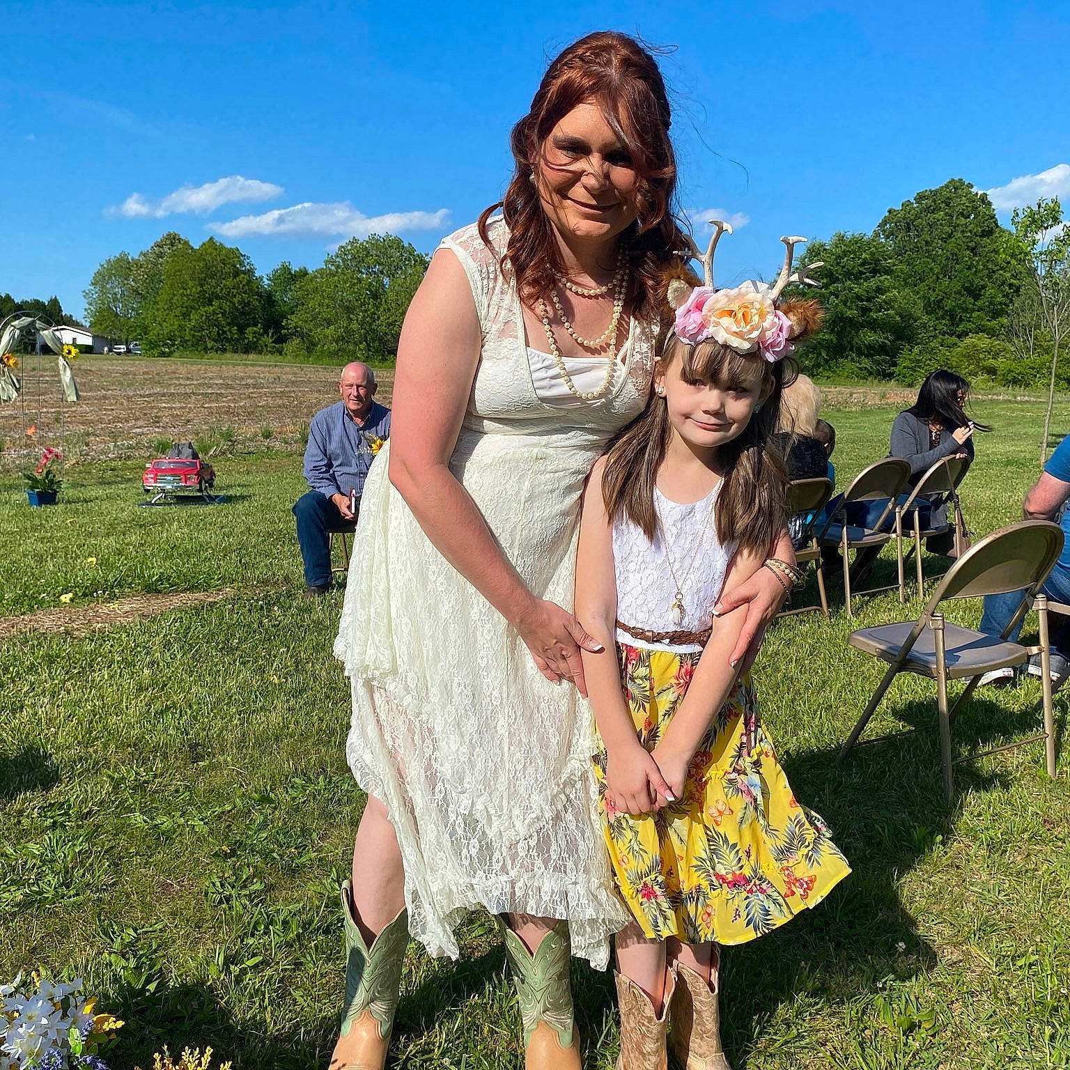 Bridgette is registered to the contest to win money with this photo: chair, day_dress, dress, event, formal_wear, fun, grass, grassland, happy, headwear, joy, leisure, meadow, one_piece_garment, people_in_nature, person, plant, recreation, sky, smile