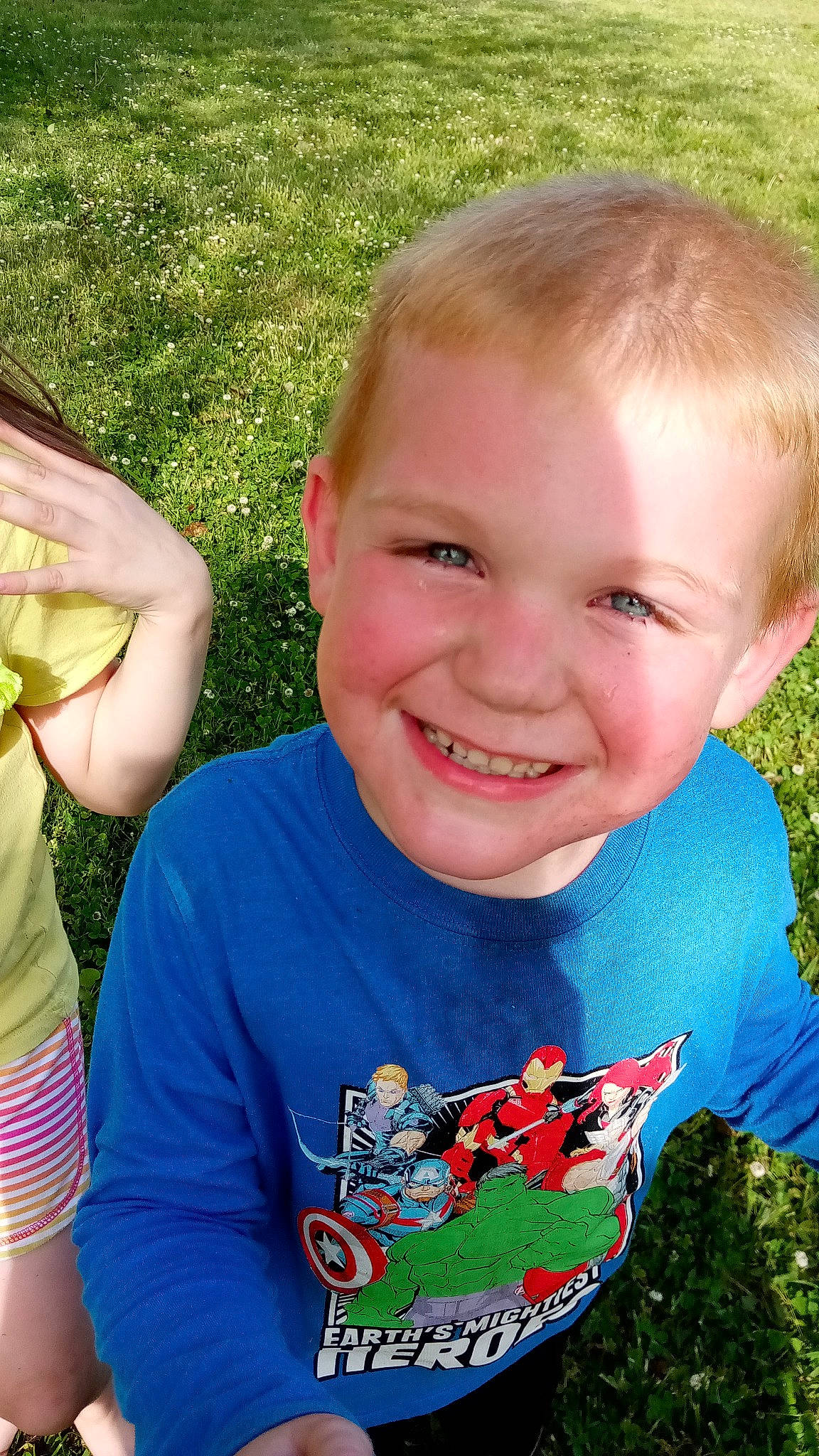 Lincoln is registered to the contest to win money with this photo: chin, eyebrow, facial_expression, forehead, green, happy, iris, joy, lip, mammal, mouth, neck, nose, organ, people_in_nature, person, plant, skin, sleeve, smile