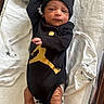 Leon joined the competition — help win amazing prizes! baby, infant, black_clothing, gold_logo, hat, blanket, white_blanket, stars_pattern, lying_down, newborn, cute, sleepwear, footwear, baby_clothes, indoor, portrait, small_hands, small_feet, cozy, resting