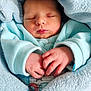 Nathan a rejoint le concours — aidez-le/la à gagner de superbes lots ! baby, newborn, sleeping, blanket, blue, hands, closeup, infant, soft, cozy, cute, peaceful, wrapped, clothing, portrait, child, skin, resting, indoors, warm