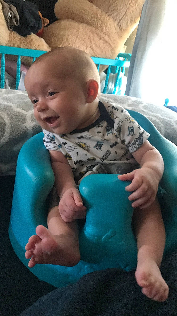 Chance is registered to the contest to win money with this photo: arm, baby, child, foot, hand, leg, person, play, sitting, skin, smile, sole, toddler