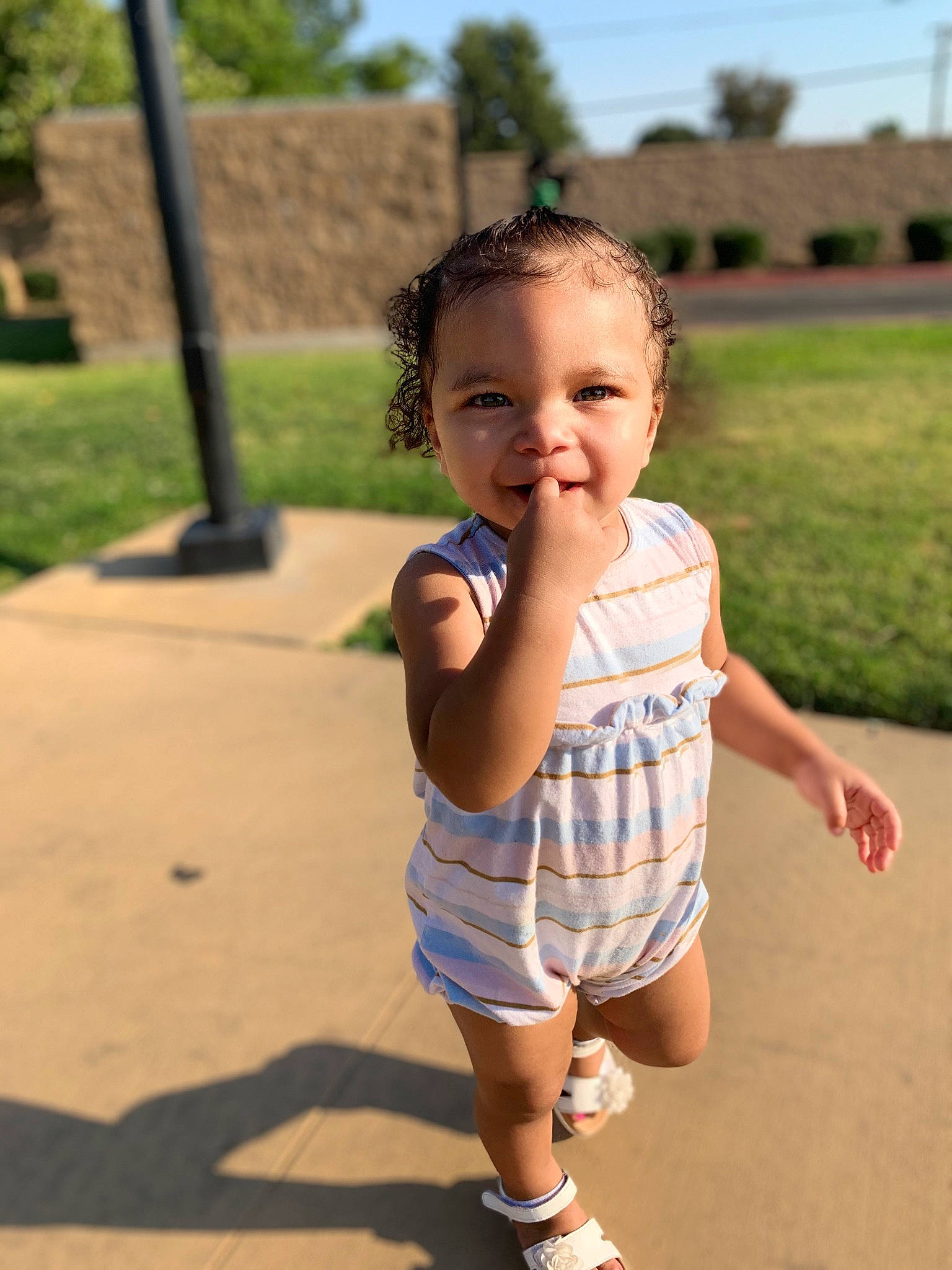 Corina joined the competition — help win amazing prizes! baby, baby_toddler_clothing, chin, eye, fun, grass, hair, happy, head, joy, leisure, person, plant, recreation, shorts, shoulder, skin, sky, sleeve, smile