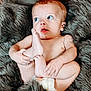 baby, infant, diaper, blue_eyes, fur_blanket, blanket, bare_chest, hand, foot, toes, cute, portrait, cozy, indoor, soft_texture, skin, gaze, laying_down, plush, expression