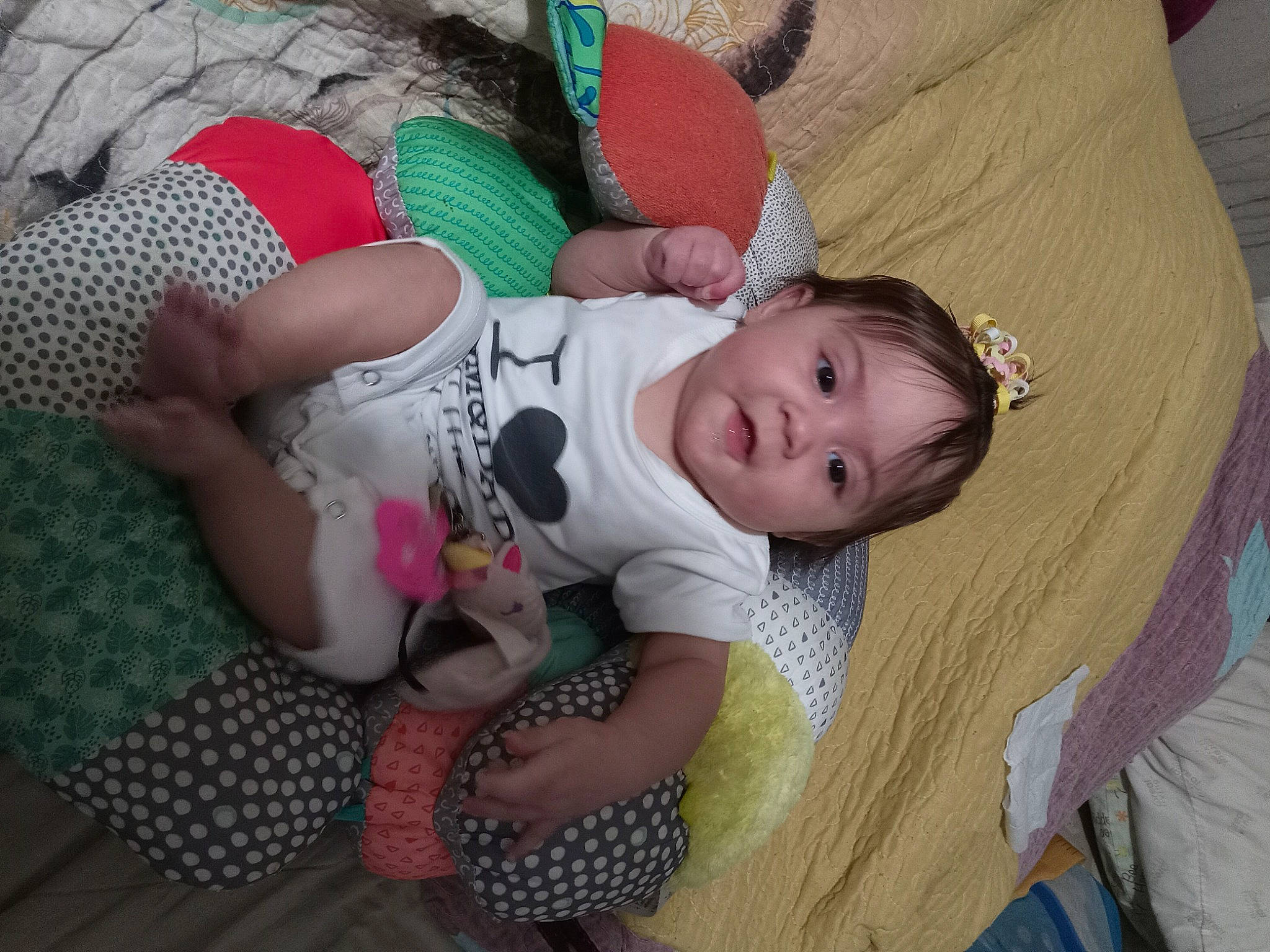 Selina is registered to the contest to win money with this photo: baby, baby_products, baby_toddler_clothing, cheek, child, comfort, fun, grass, iris, lap, linens, pattern, person, room, sitting, skin, sock, textile, thigh, toddler