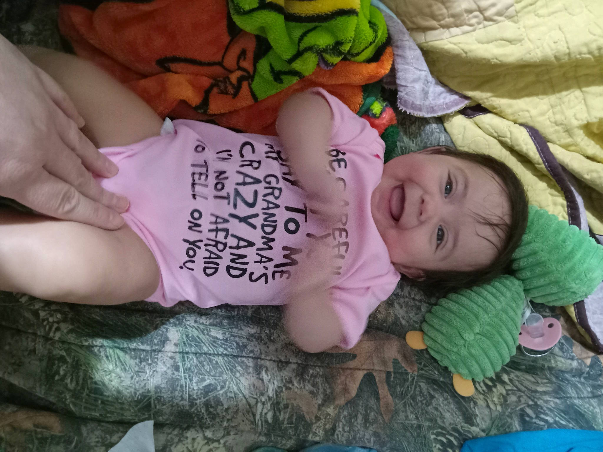 Selina joined the competition — help win amazing prizes! baby, baby_products, baby_toddler_clothing, cheek, child, comfort, grass, green, happy, human_body, mouth, person, photography, pink, sitting, skin, smile, thigh, toddler