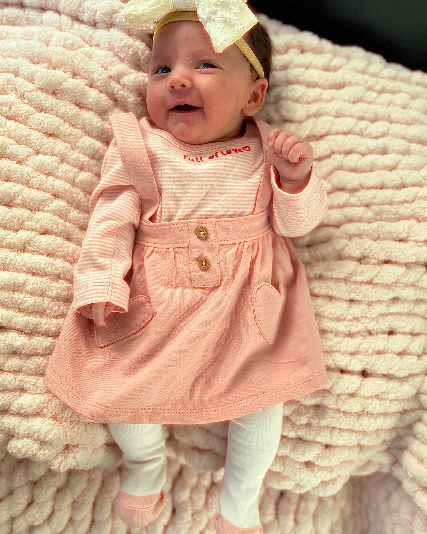 Leighton joined the competition — help win amazing prizes! baby, baby_toddler_clothing, cap, cheek, doll, dress, fashion_accessory, happy, head, headwear, linens, pattern, peach, person, pink, skin, sleeve, smile, textile, toddler