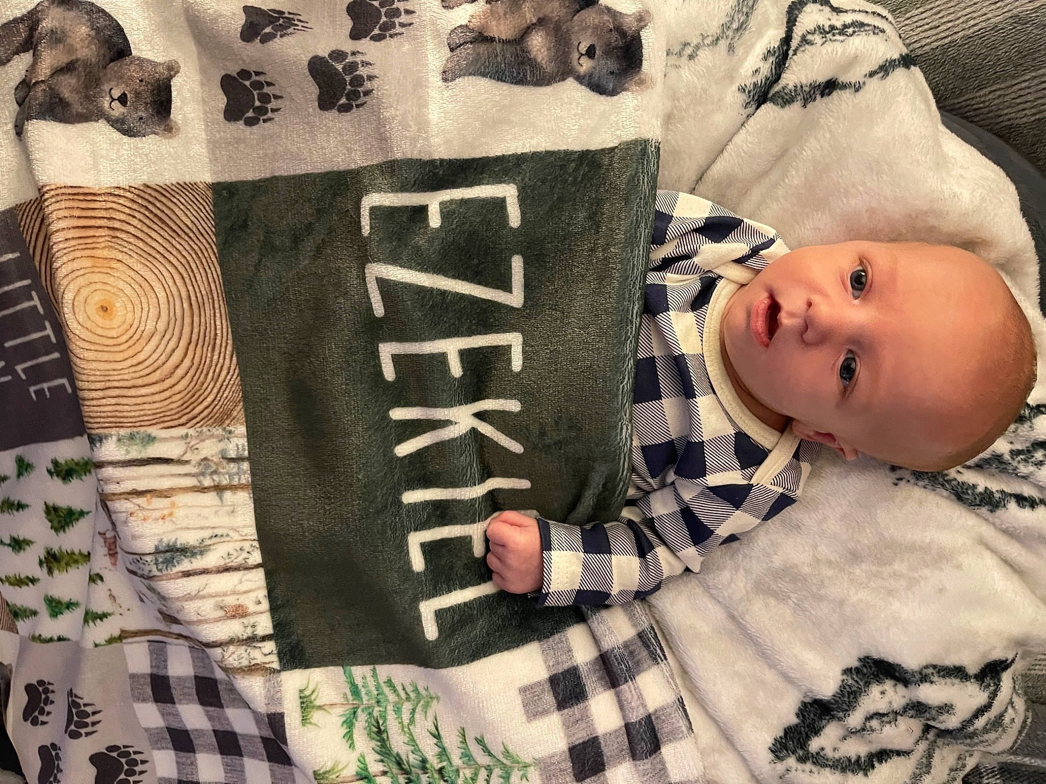 Ezekiel joined the competition — help win amazing prizes! baby, baby_toddler_clothing, comfort, cool, couch, craft, creative_arts, fur, linens, outerwear, pattern, person, plaid, room, sitting, sleeve, t_shirt, textile, toddler, visual_arts