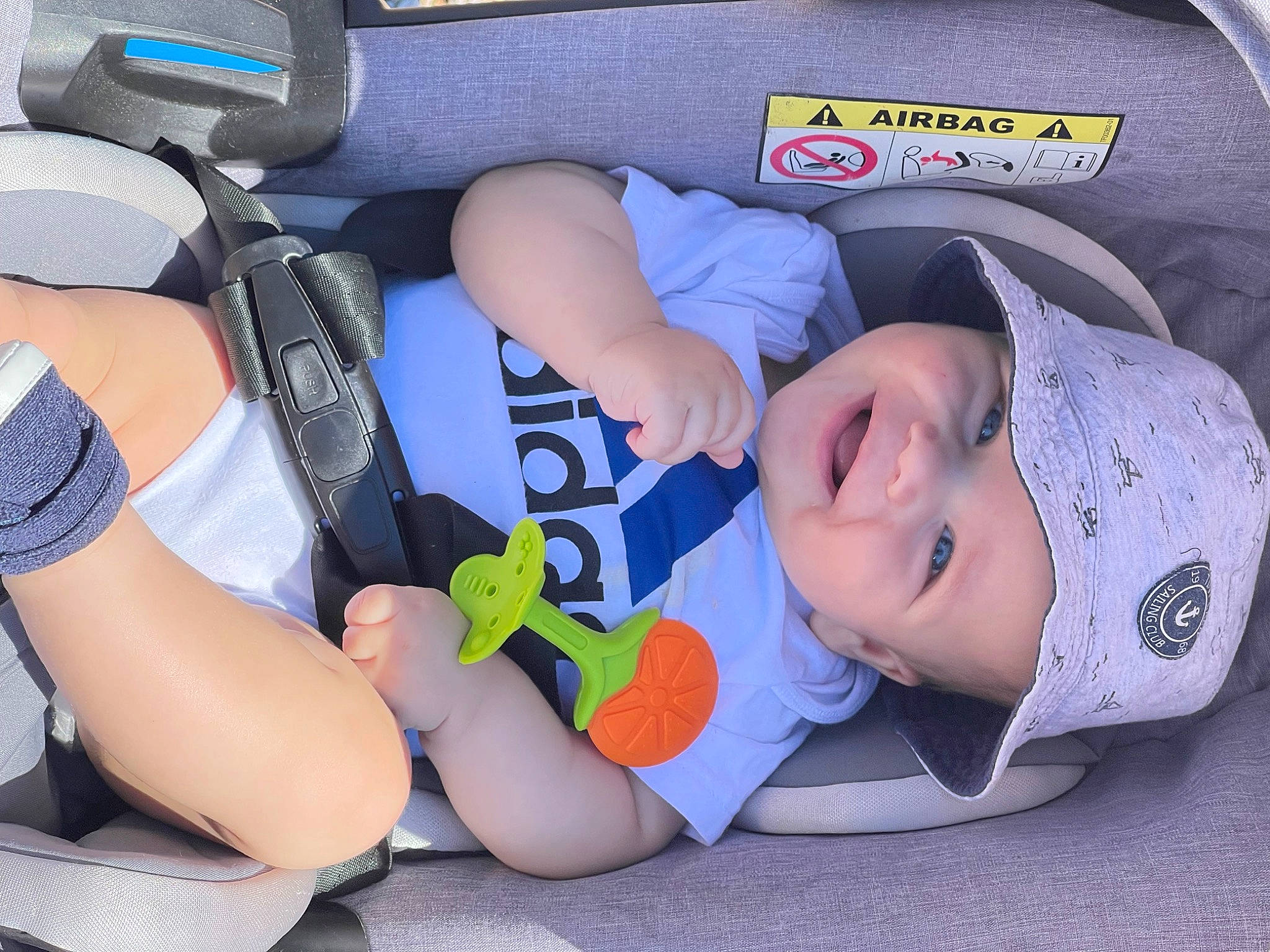 David is registered to the contest to win money with this photo: auto_part, baby, baby_carriage, baby_products, baby_toddler_clothing, car_seat, child, comfort, grass, headwear, human_leg, knee, lap, person, sitting, sleep, thigh, toddler