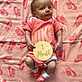 baby, infant, nike, blanket, onesie, socks, wooden_sign, month_marker, portrait, cute, clothing, laying_down, baby_boy, baby_girl, fashion, brand_logo, soft_texture, indoor, newborn, celebration