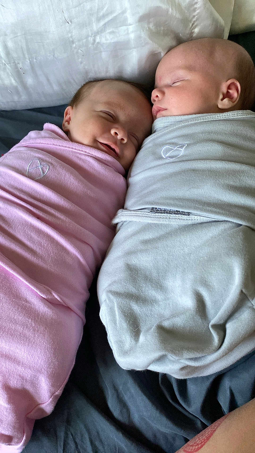 Leland And Adaline joined the competition — help win amazing prizes! baby, infant, newborn, swaddled, sleeping, bed, blanket, pink, gray, cute, peaceful, child, face, head, resting, person, indoor, soft, warm, together