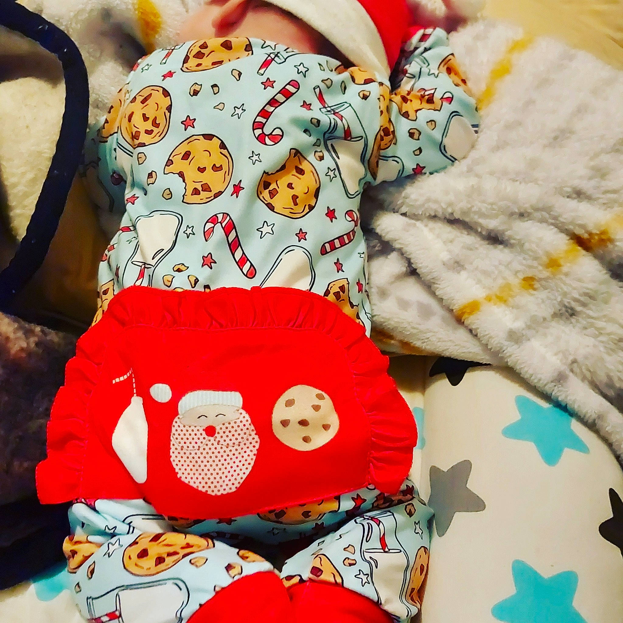 Athena is registered to the contest to win money with this photo: baby_products, baby_sleeping, baby_toddler_clothing, bag, bedding, carmine, child, comfort, drinkware, fashion_accessory, font, linens, orange, pattern, product, room, sleeve, textile, throw_pillow, white