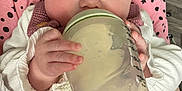 Hollie is registered to the contest to win money with this photo: baby, beverage, blanket, bodypart, cup, cushion, disposablecup, drinking, face, finger, hand, head, homedecor, jar, juice, milk, newborn, person, photography, portrait