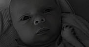 Jayce joined the competition — help win amazing prizes! baby, blanket, child, closeup, clothing, cute, expression, face, indoors, infant, lying_down, monochrome, newborn, pillow, portrait, resting, sleepwear, soft, wrapped, young