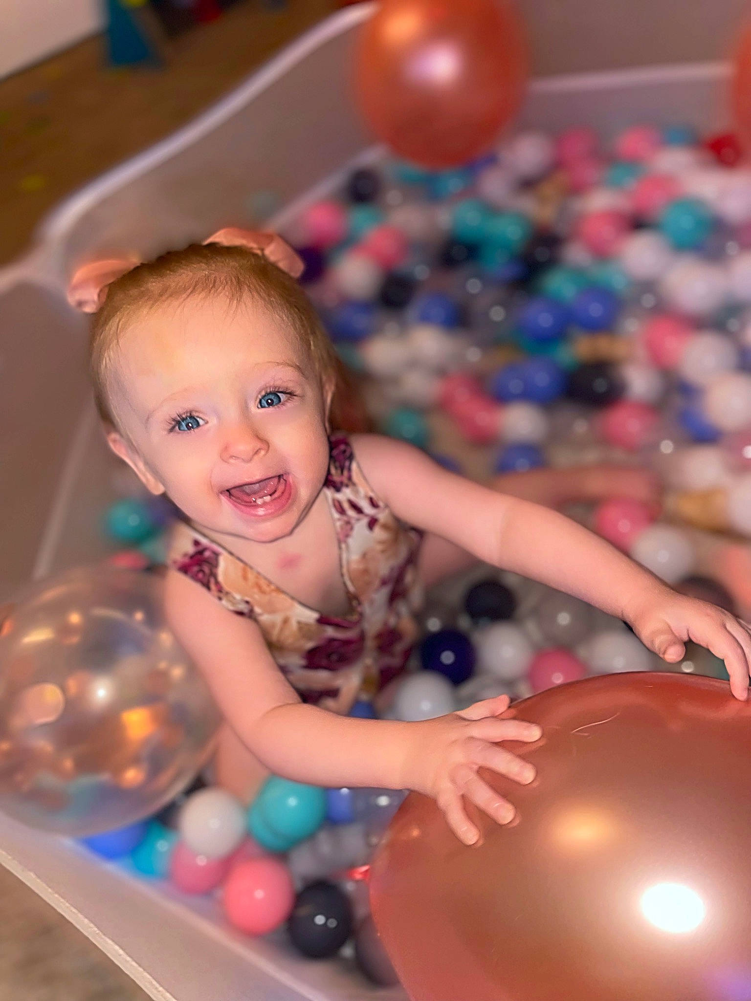 Ayla Stedman joined the competition — help win amazing prizes! baby, baby_playing_with_toys, ball, child, event, fun, happy, leisure, party_supply, person, photograph, pink, play, recreation, smile, snapshot, sweetness, toddler, toy, water