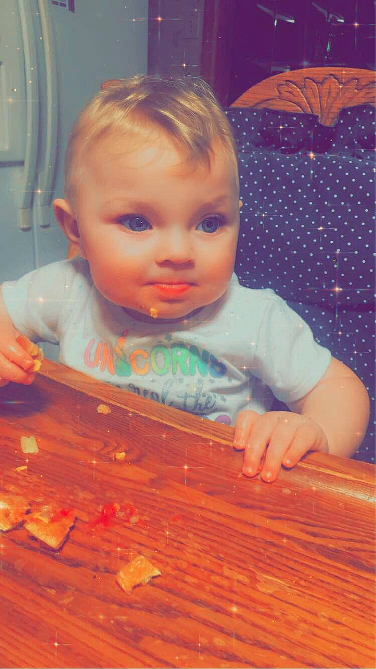 Marlie is registered to the contest to win money with this photo: baby, cheek, child, eye, face, floor, fun, head, iris, lip, nose, person, play, skin, smile, toddler, tummy_time, wood