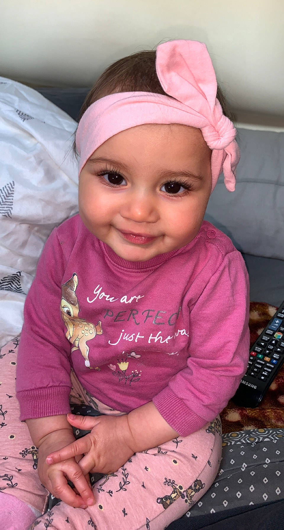 Leyannah participe au concours pour gagner de l'argent avec cette photo : baby_toddler_clothing, cap, cheek, chin, eye, face, guitar_accessory, head, headwear, joy, lip, musical_instrument, nose, organ, person, photograph, pink, purple, skin, sleeve