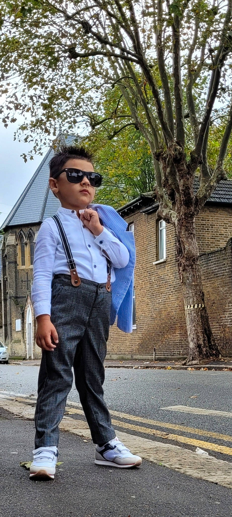 Maximilian Zian joined the competition — help win amazing prizes! asphalt, blazer, collar, cool, denim, dress_shirt, eyewear, glasses, goggles, person, plaid, road, road_surface, shirt, sky, sleeve, sunglasses, tartan, tree, vision_care