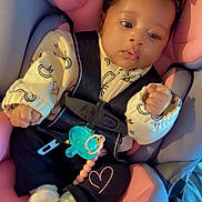 Alaya Rae is registered to the contest to win money with this photo: baby, child, car_seat, pink, gray, headband, pacifier, clothing, infant, cute, face, hands, socks, safety_harness, seatbelt, indoor, portrait, cute_expression, newborn, resting