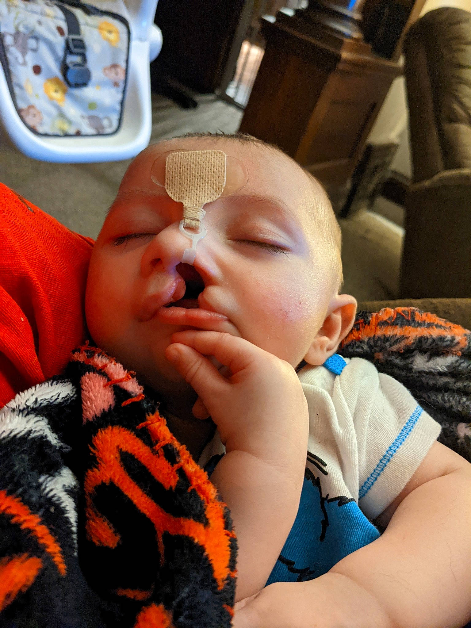 Merlin joined the competition — help win amazing prizes! baby, baby_in_car_seat, baby_sleeping, baby_toddler_clothing, car_seat, chair, cheek, child, chin, comfort, eyelash, finger, mouth, nail, nose, orange, person, product, skin, thumb