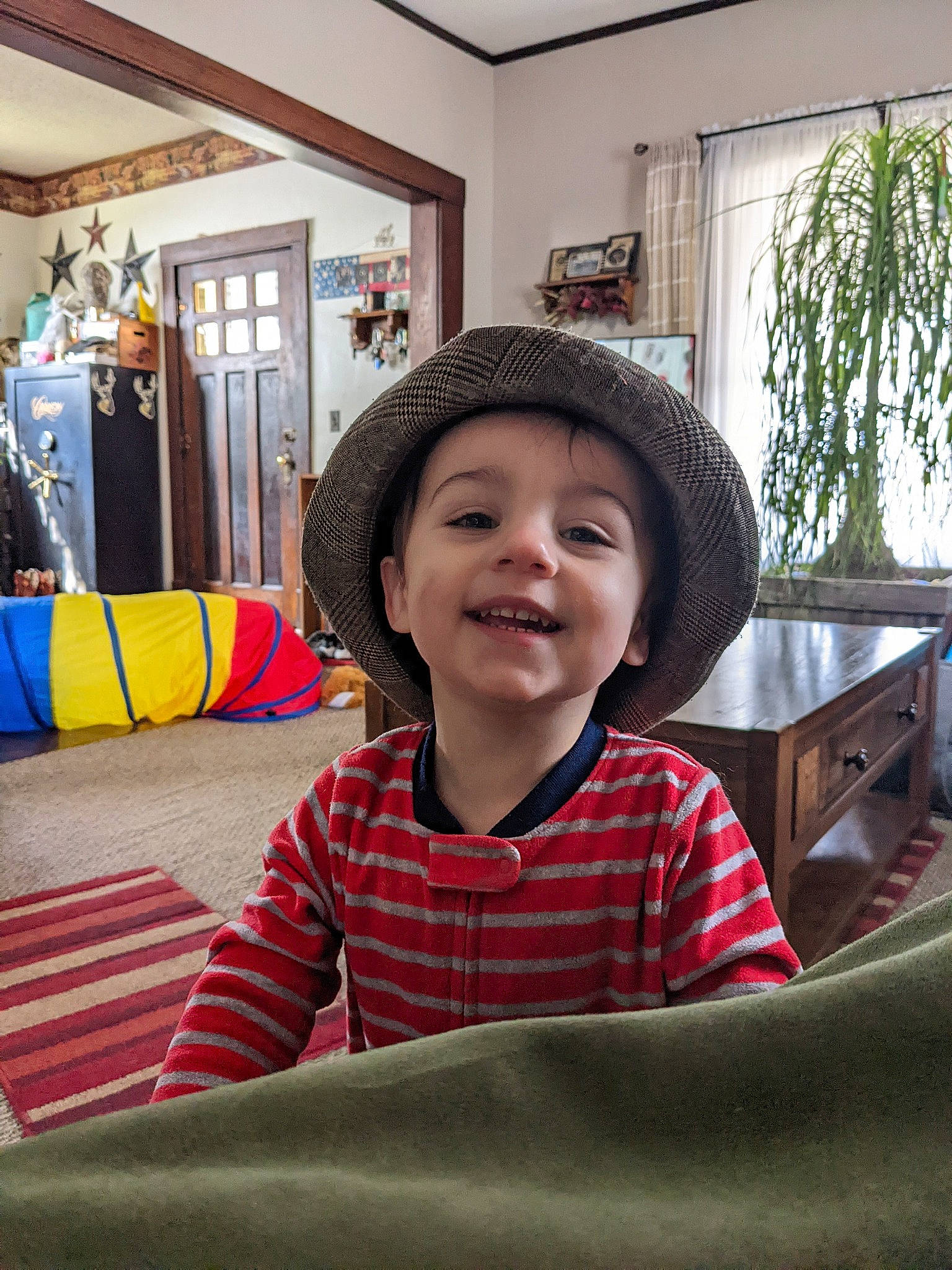 Weylin joined the competition — help win amazing prizes! cap, child, comfort, fashion_accessory, flooring, fun, happy, hat, headgear, headwear, house, joy, leisure, person, plant, room, sitting, smile, sun_hat, table