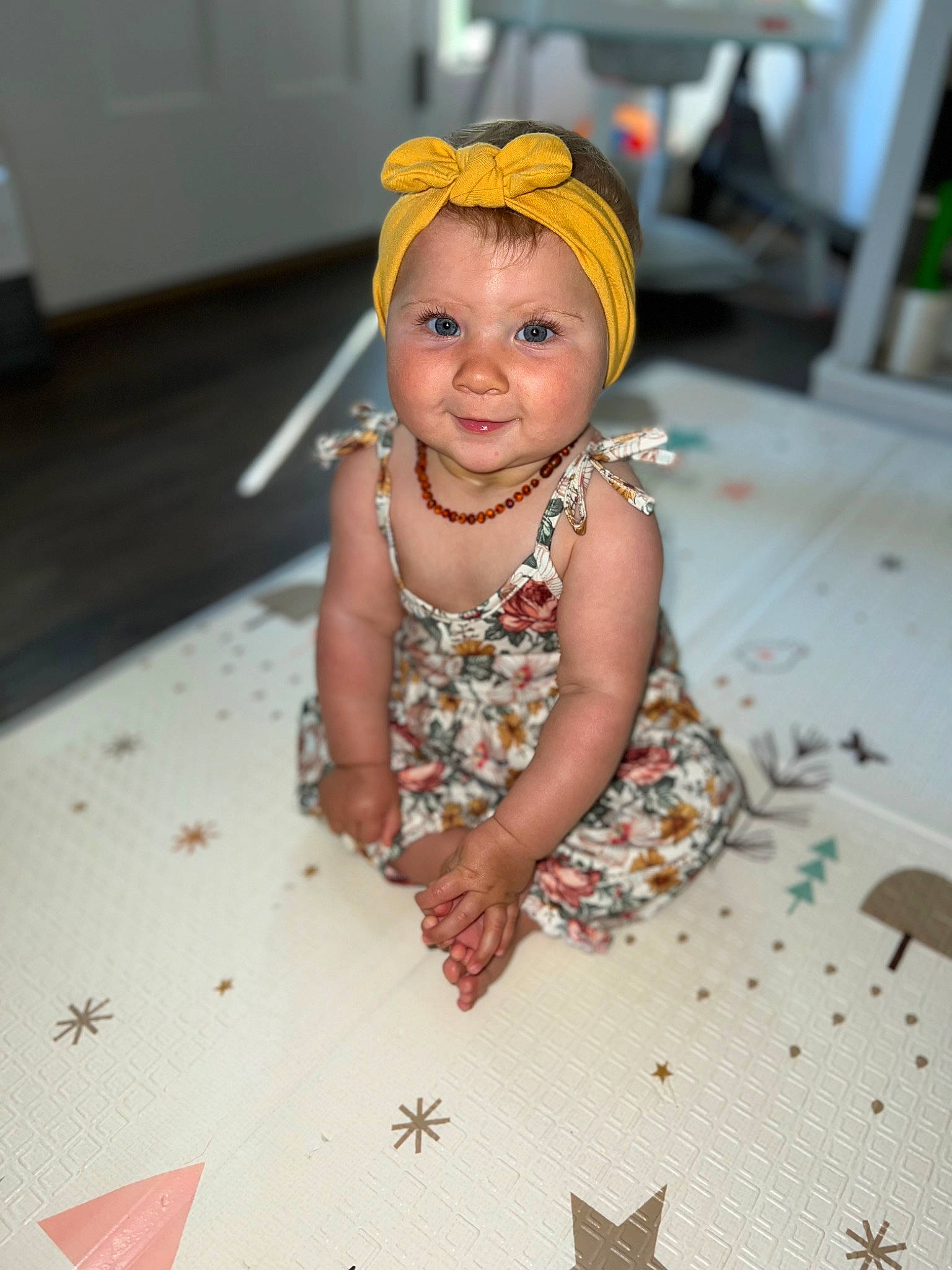 Kensley joined the competition — help win amazing prizes! baby, baby_toddler_clothing, child, dress, event, fashion_accessory, fashion_design, floor, flooring, fun, happy, headwear, jewellery, joy, pattern, peach, person, room, sitting, sleeve