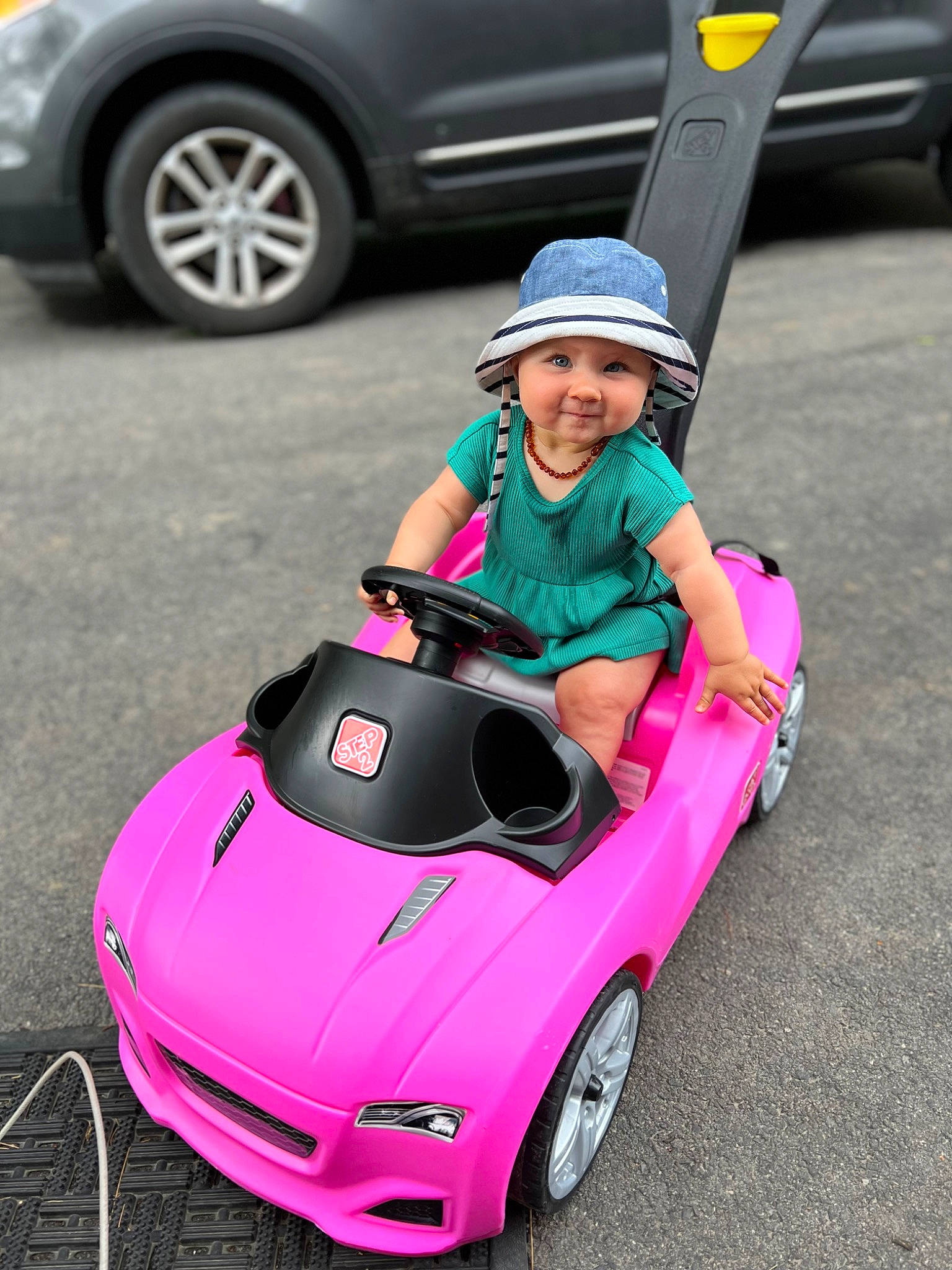 Kensley joined the competition — help win amazing prizes! automotive_design, automotive_exterior, automotive_lighting, automotive_tire, car, dress, headwear, helmet, hood, jeans, joy, motor_vehicle, person, photograph, pink, riding_toy, sunglasses, tire, toy, vehicle