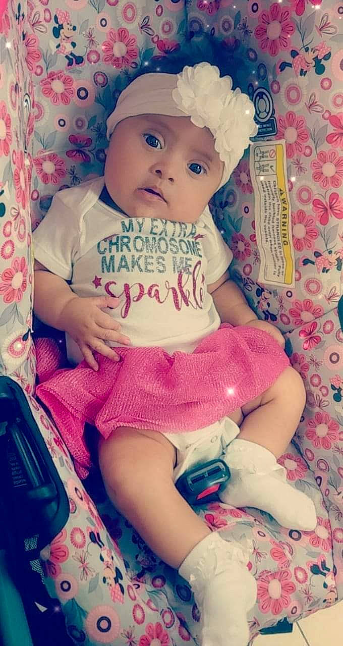 Ana is registered to the contest to win money with this photo: baby, baby_toddler_clothing, beauty, cap, cheek, child, cool, costume_hat, happy, hat, headwear, magenta, pattern, person, pink, product, skin, sleeve, t_shirt, textile