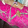 cat, orange_tabby, sleeping, harness, pink_blanket, leaf_pattern, couch, brown_leather, curtains, indoor, pet, resting, feline, cozy, closeup, domestic_animal, fur, relaxing, animal, home