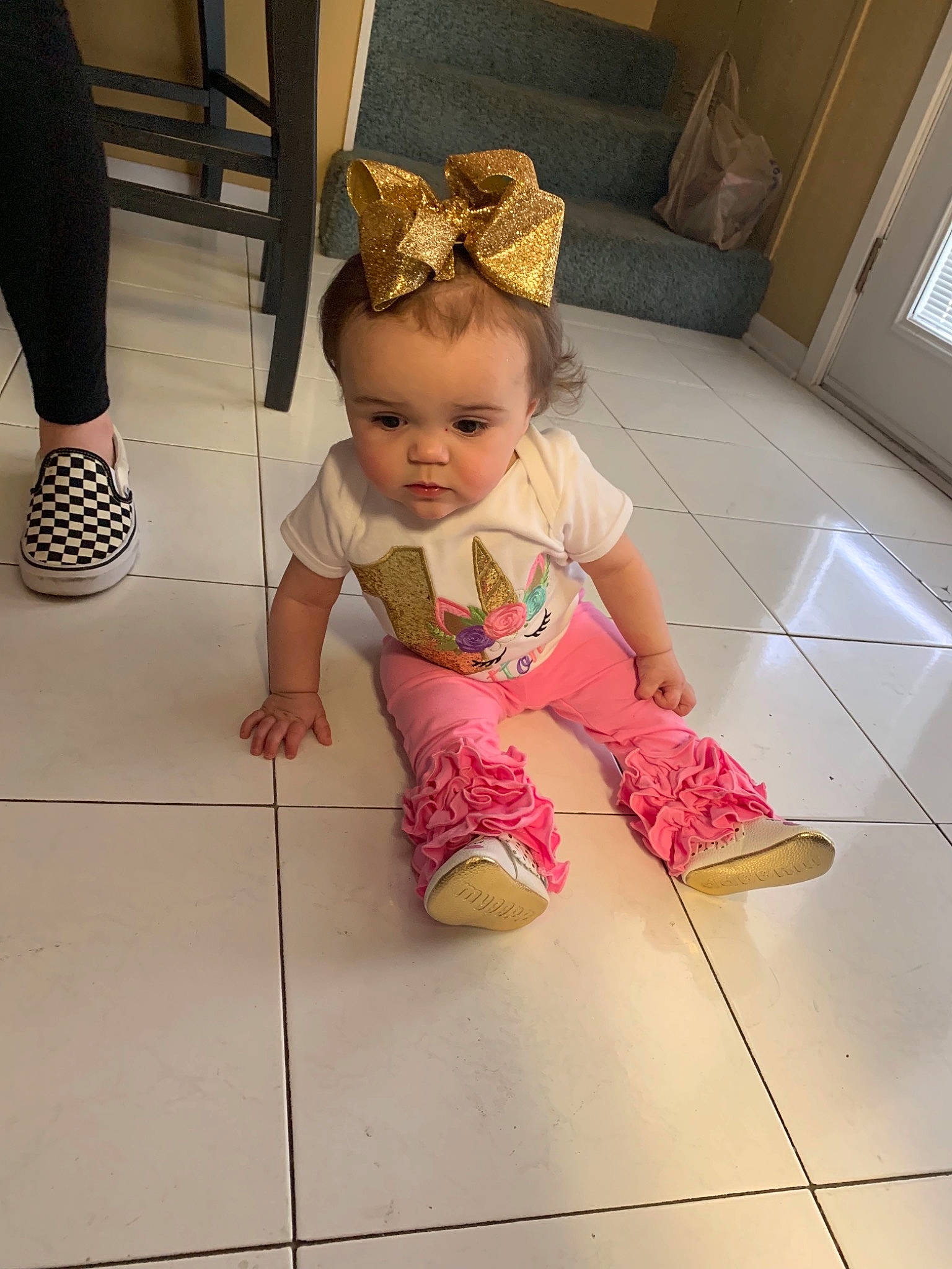 Sutton is registered to the contest to win money with this photo: baby, child, floor, flooring, footwear, leg, person, pink, play, shoe, skin, smile, standing, toddler