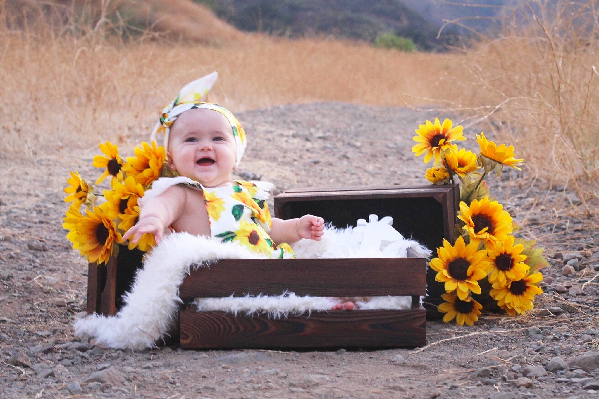 Blakely joined the competition — help win amazing prizes! baby, child, fawn, flower, fun, headwear, person, photograph, photography, plant, sitting, sunflower, toddler, wildflower, yellow