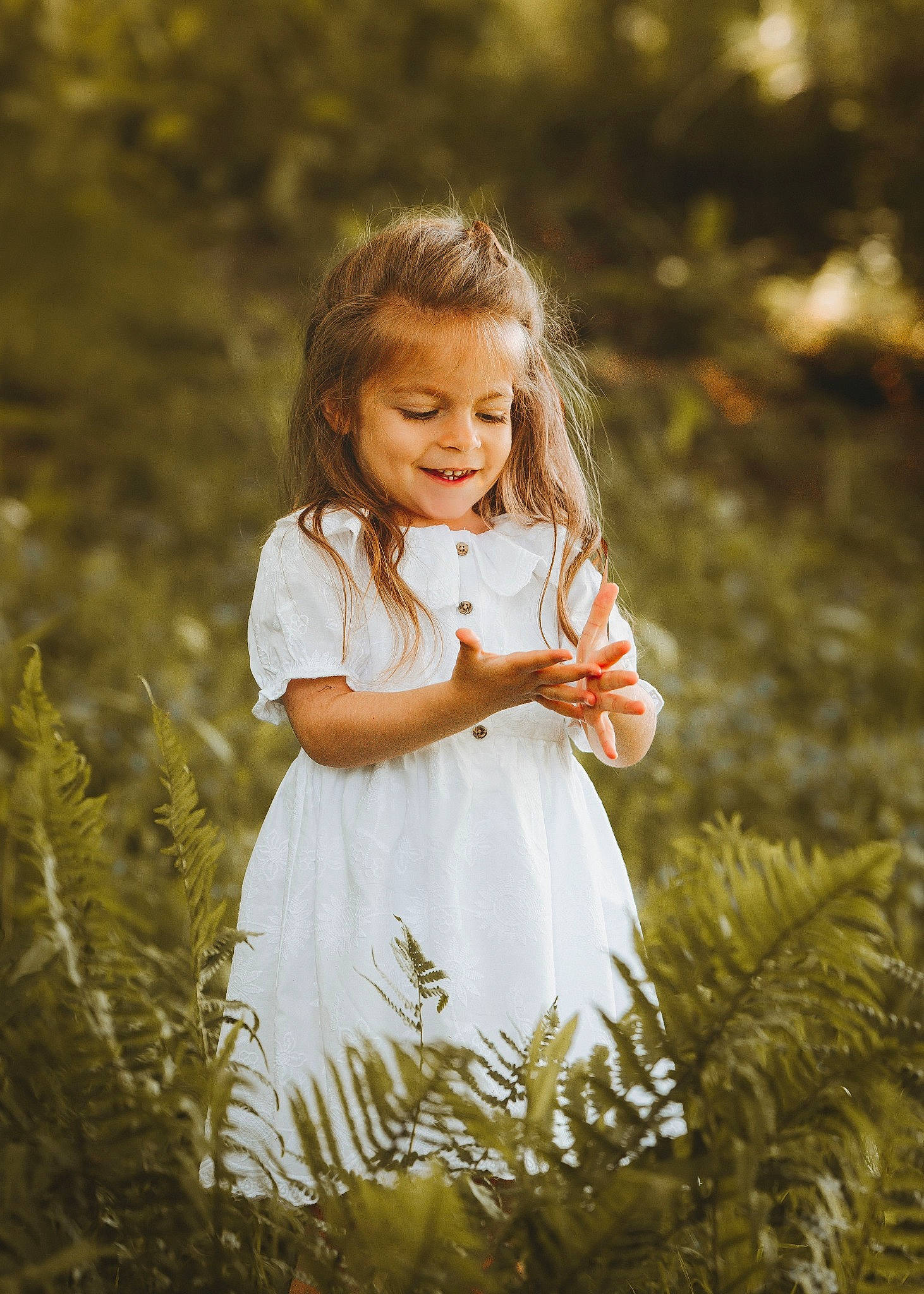Sarah joined the competition — help win amazing prizes! branch, dress, eye, flash_photography, forest, grass, grass_family, grassland, happy, head, iris, joy, meadow, natural_landscape, people_in_nature, person, plant, smile, standing, toddler