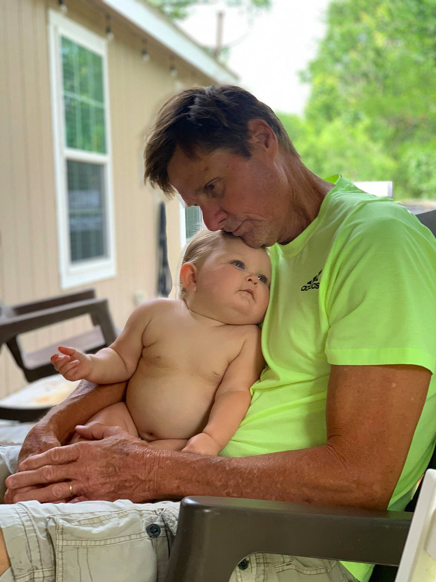 Hensley joined the competition — help win amazing prizes! abdomen, baby, barechested, child, father, male, mother, muscle, person, sitting, vacation