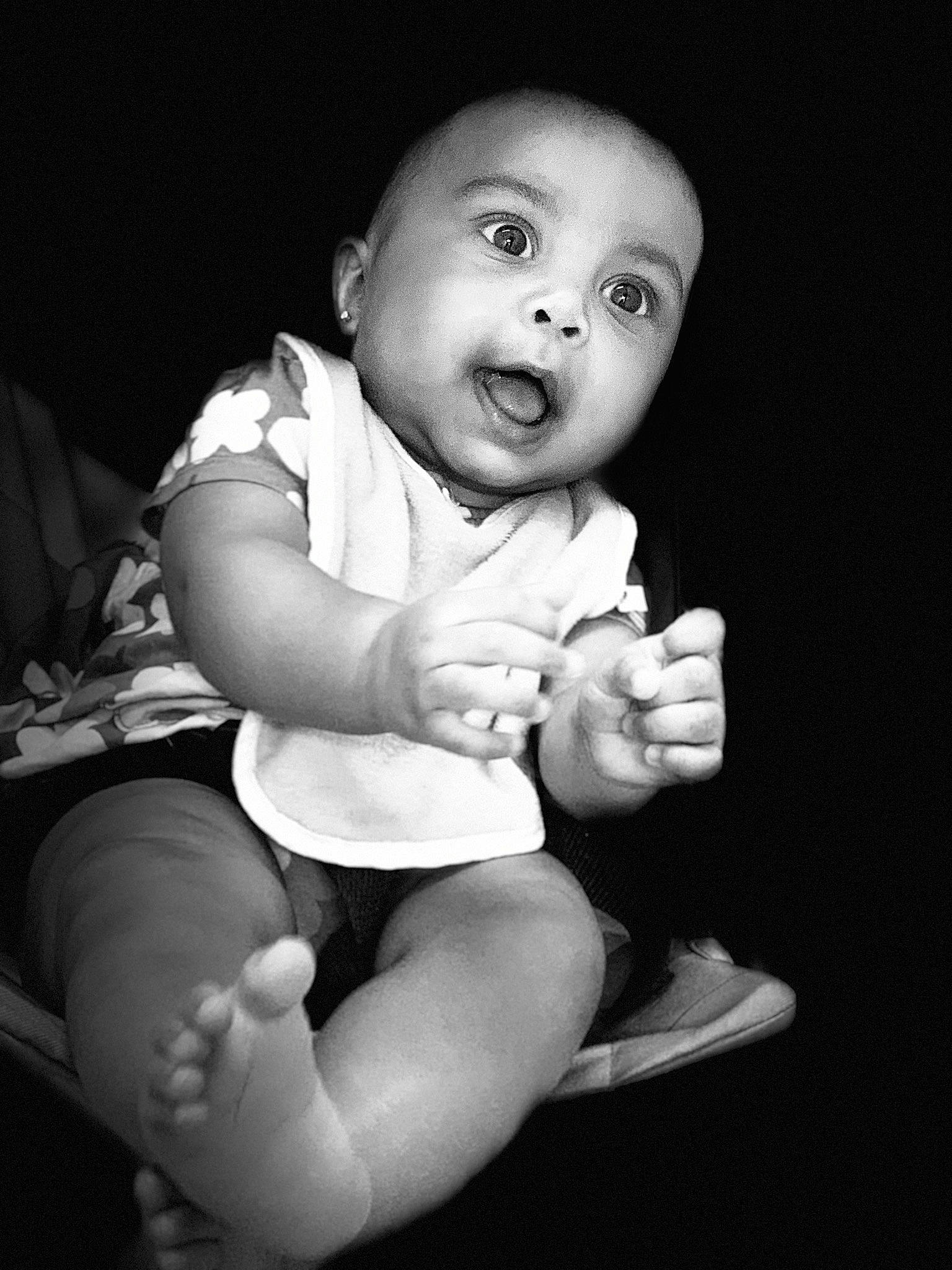 Katalena is registered to the contest to win money with this photo: arm, baby, baby_toddler_clothing, black, black_and_white, comfort, elbow, eye, finger, flash_photography, gesture, hand, happy, human, knee, leg, nail, person, style, surprise
