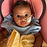 baby, infant, child, face, eyes, feeding_tube, blanket, blue_clothing, pink_cushion, hospital, medical, healthcare, resting, portrait, closeup, skin, hands, young_child, indoors, cute