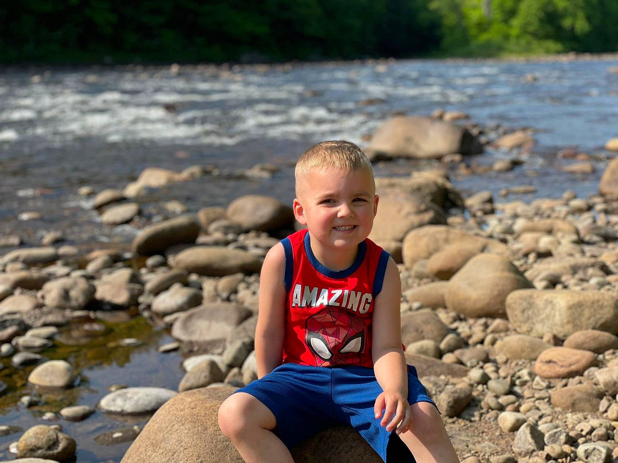 Preston joined the competition — help win amazing prizes! beach, body_of_water, child, coast, flash_photography, fun, happy, joy, landscape, leisure, ocean, people_in_nature, people_on_beach, person, recreation, rock, sand, sitting, summer, t_shirt