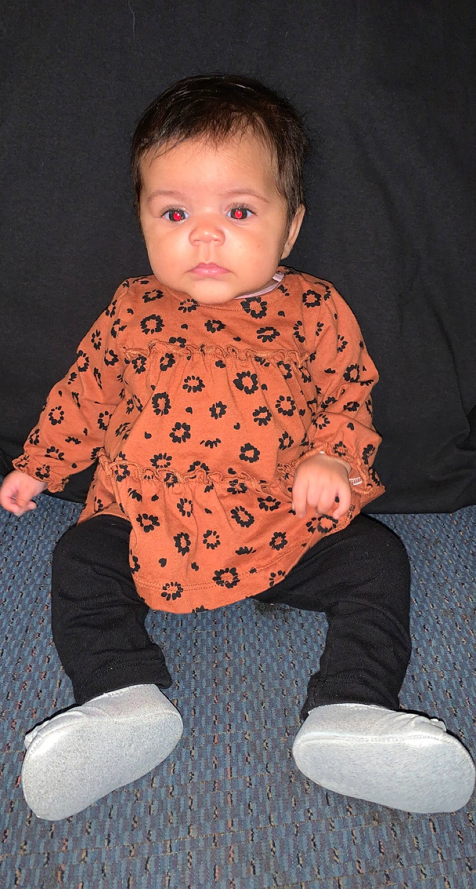 Bristol is registered to the contest to win money with this photo: arm, baby, baby_toddler_clothing, cheek, face, finger, floor, flooring, human_body, joint, knee, leg, neck, outerwear, person, sleeve, standing, textile, toddler, vertebrate