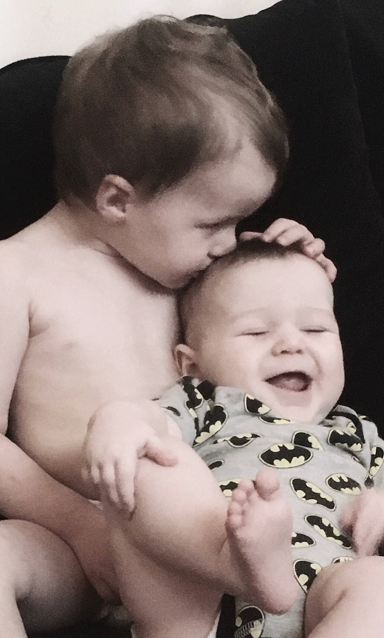 Finnick is registered to the contest to win money with this photo: baby, black_and_white, cheek, child, father, finger, gesture, hand, interaction, love, mother, person, photography, sibling, skin, toddler